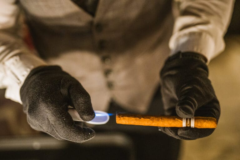 A professional serving a cigar
