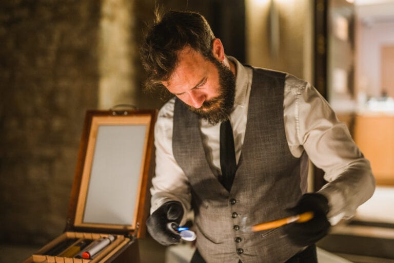 A professional serving a cigar