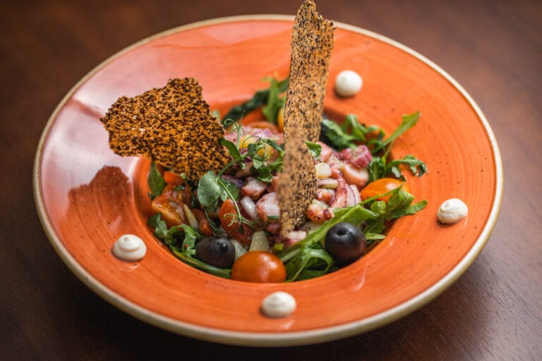 Octopus salad with plate decor